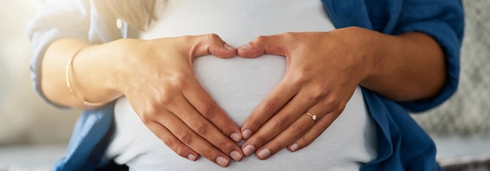 Chiropractic St. George UT Woman Heart Over Belly Healthy Pregnancy Chiropractic St. George UT Woman Heart Over Belly Healthy Pregnancy